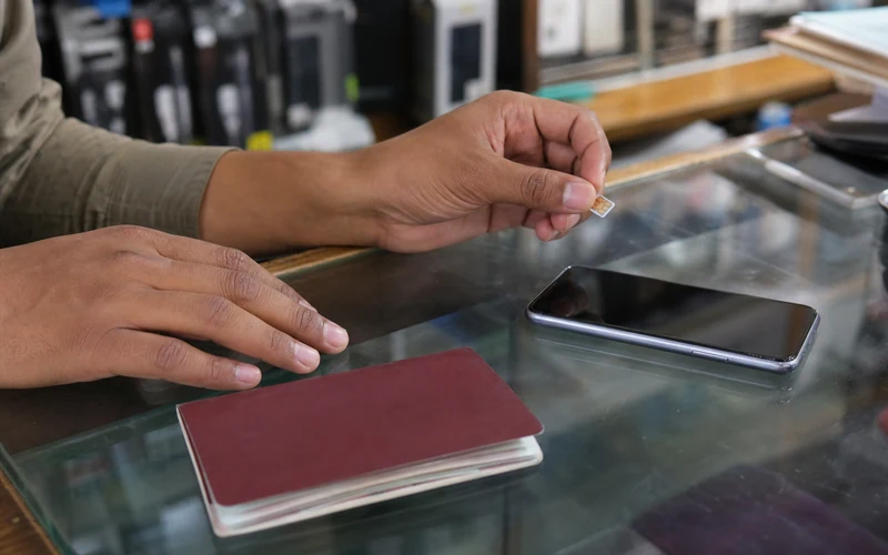 Registering a prepaid SIM with a passport at a carrier store